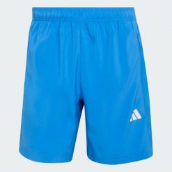 Tkane Szorty Do Ćwiczeń Essentials Base. Niebieskie szorty sportowe męskie ADIDAS, bez wzorów, sportowe. Za 119.00 zł.