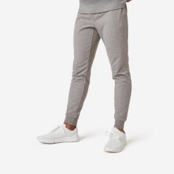 Spodnie dresowe męskie Nyamba Gym & Pilates 500 slim. Szare spodnie dresowe męskie DOMYOS, bez wzorów, z bawełny. W wyprzedaży za 69.99 zł.