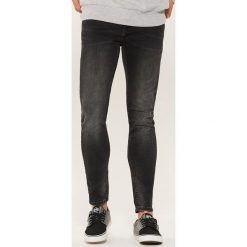 Jeansy skinny - Czarny. Czarne jeansy męskie House, z jeansu. Za 99.99 zł.