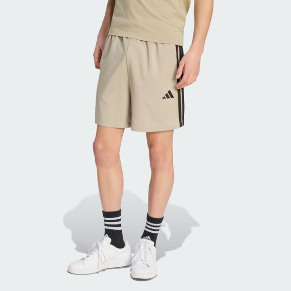 Szorty Essentials 3-Stripes Chelsea. Brązowe szorty sportowe męskie ADIDAS, bez wzorów, z materiału, sportowe. Za 119.00 zł.
