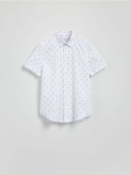 Bawełniana koszula slim fit - granatowy. Niebieskie koszule męskie Reserved, l, bez wzorów, z bawełny, bez kołnierzyka, bez ramiączek. Za 99.99 zł.