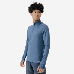 Bluza do biegania męska Kiprun Run 100 Warm. Niebieskie bluzy nierozpinane męskie KIPRUN, m, bez wzorów, z elastanu, sportowe, bez ramiączek, bez kaptura. W wyprzedaży za 44.99 zł.