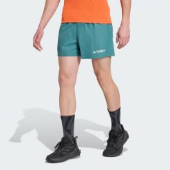Szorty Terrex Multi. Niebieskie szorty sportowe męskie ADIDAS, bez wzorów, sportowe. W wyprzedaży za 142.35 zł.