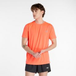 Koszulka męska New Balance MT41222URR – pomarańczowa. Brązowe t-shirty sportowe męskie New Balance, m, bez wzorów, z materiału, sportowe, bez ramiączek. Za 149.99 zł.
