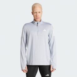 Bluza Own The Run Half-Zip. Szare bluzy nierozpinane męskie ADIDAS, xl, bez wzorów, z materiału, sportowe, bez ramiączek, bez kaptura. W wyprzedaży za 181.75 zł.