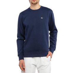 Bluza męska sportowa Tommy Hilfiger TJM REGULAR FLEECE. Niebieskie bluzy nierozpinane męskie Tommy Hilfiger, m, bez wzorów, sportowe, bez ramiączek, bez kaptura. W wyprzedaży za 249.00 zł.