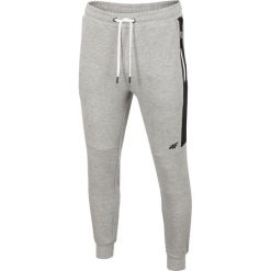 Spodnie dresowe męskie SPMD206 - chłodny jasny szary melanż. Spodnie dresowe męskie marki 4f. Za 149.99 zł.