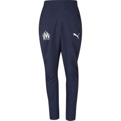 Spodnie "Olympique Marseille" w kolorze granatowym. Długie spodnie sportowe męskie Puma. W wyprzedaży za 107.95 zł.