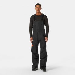 Spodnie narciarskie z szelkami Helly Hansen Elevation Infin Shell. Czarne spodnie narciarskie i snowboardowe męskie Helly Hansen, bez wzorów, narciarskie. W wyprzedaży za 2,573.50 zł.